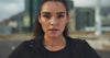 Trū Start. woman with an intense look breathing deeply getting ready to work out.